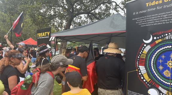 Community members at Musgrave Park, Meanjin, gathering at the Treaty stand